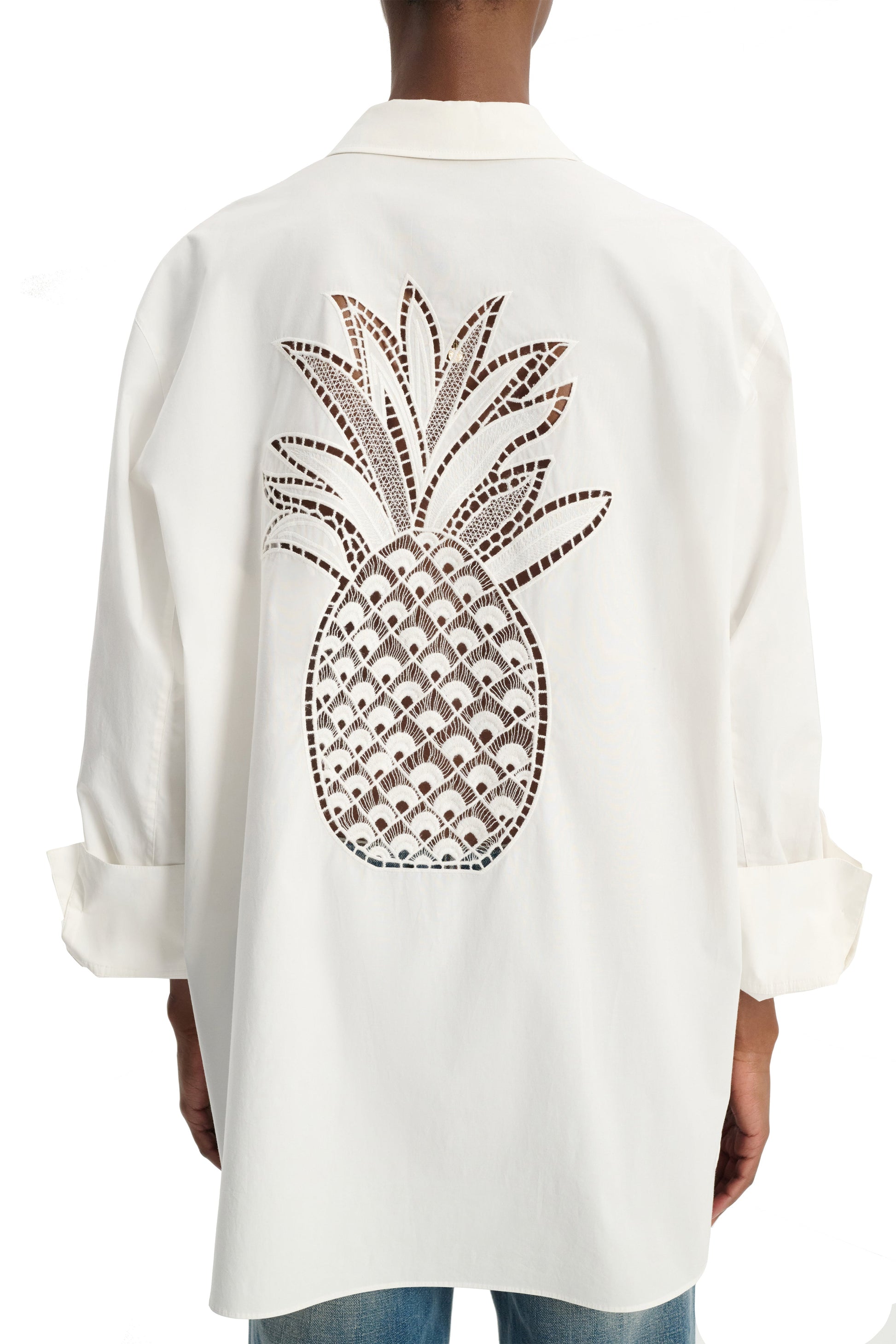 Person wearing a Dorothee Schumacher Poplin Power Pineapple Blouse by Dorothee Schumacher with a large pineapple embroidery on the back.