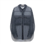 The Dorothee Schumacher Transparent Stripe Blouse by Dorothee Schumacher is a blue and white striped button-up shirt with an oversized silhouette, featuring long sleeves and two front chest pockets, displayed on a plain white background.