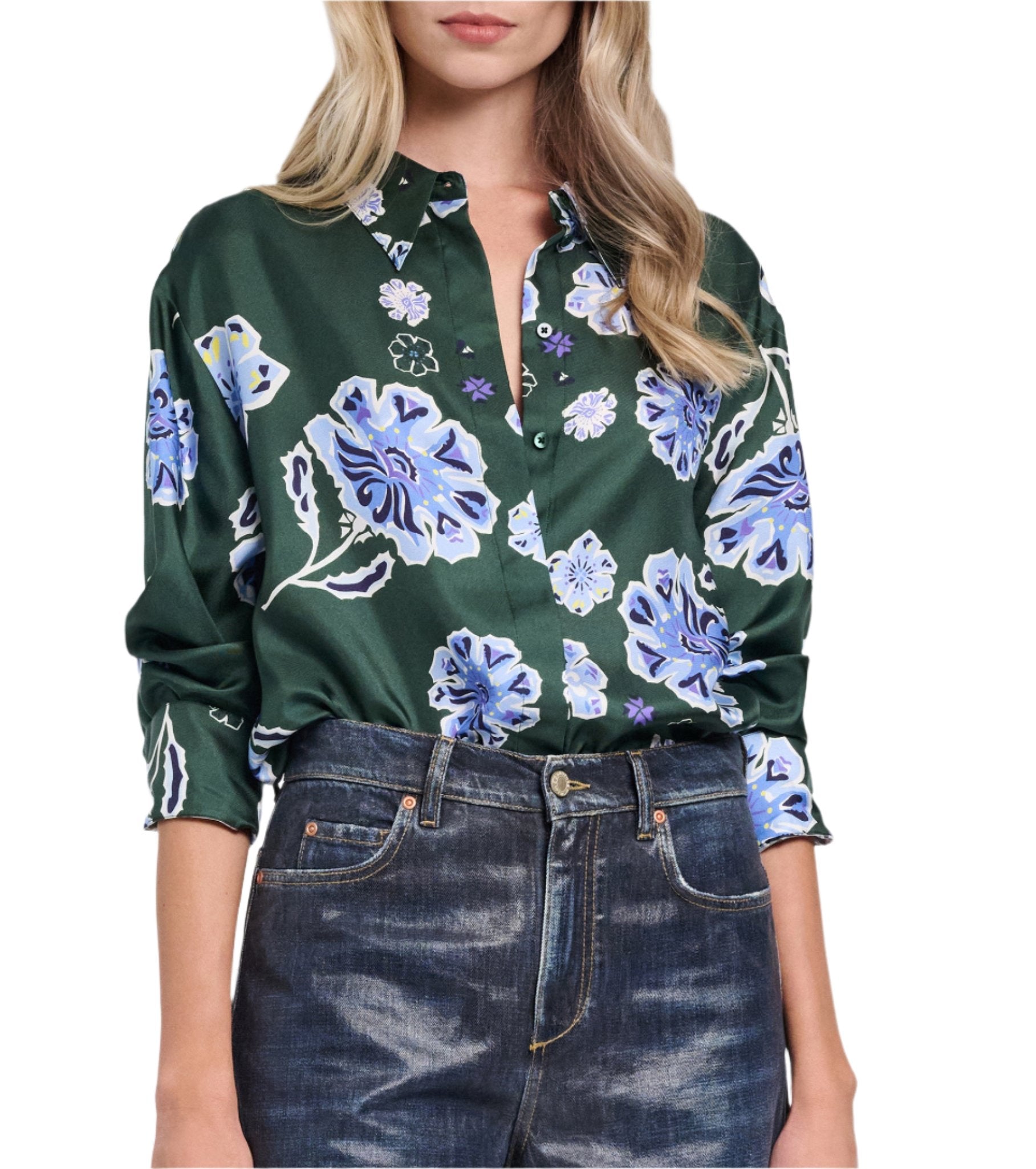 A person wearing the Dorothee Schumacher Big Garden Blouse, a relaxed fit green silk twill blouse with a blue and white floral print, paired with dark jeans.