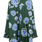 Back view of the Dorothee Schumacher Big Garden Blouse by Dorothee Schumacher, featuring a dark green long-sleeve design in silk twill with a relaxed fit and a blue and white floral pattern.