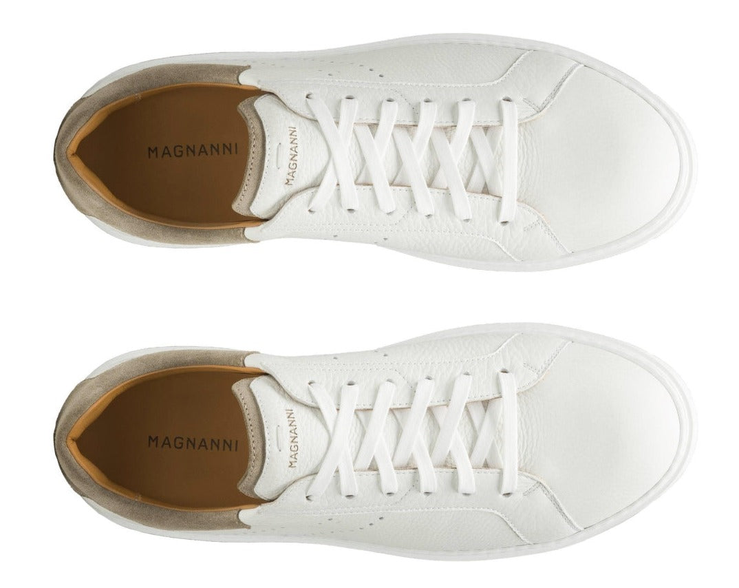 Top view of the Magnanni Reina III Sneakers, a pair of white leather footwear featuring an updated aesthetic, complete with white laces and "Magnanni" labeling on the insoles.