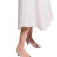A person wears the Dorothee Schumacher Poplin Power Skirt and light green open-toe kitten heel sandals, standing against a white background.