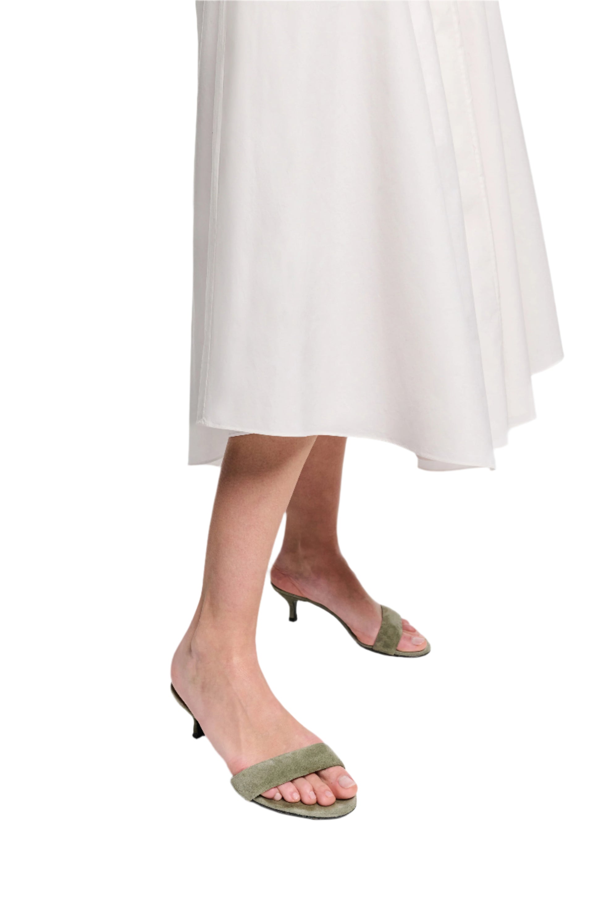 A person wears the Dorothee Schumacher Poplin Power Skirt and light green open-toe kitten heel sandals, standing against a white background.