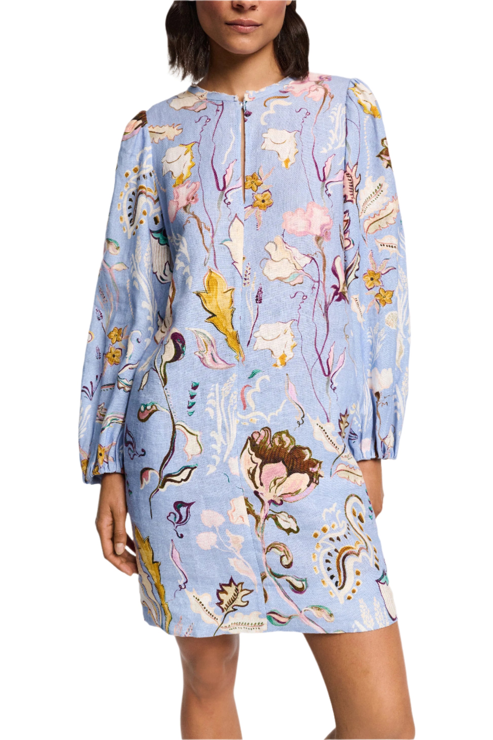 An individual wearing the Dorothee Schumacher Floral Power Mini Dress in light blue linen, showcasing voluminous long sleeves with a multi-colored floral and abstract pattern.