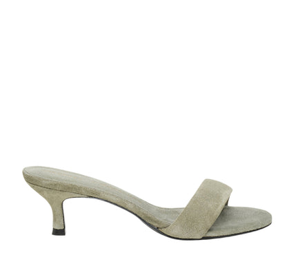 The Dorothee Schumacher Suede Sensation Kitten Heel is a single light green suede sandal featuring an open toe, slim kitten heel, and a stylish padded strap on a white background.