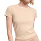 A woman wears the Dorothee Schumacher All Time Favorites Shirt, a short-sleeve beige fitted t-shirt in stretch cotton, with matching pants. She stands against a white background, her face partially out of frame.