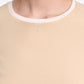 A close-up of a person wearing the All Time Favorites Shirt by Dorothee Schumacher, featuring a white collar, small metallic emblem near the neckline, and crafted from comfortable stretch cotton for an effortless fitted style.