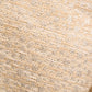 Close-up of the Shiny Coolness Jacket by Dorothee Schumacher, featuring textured beige fabric with a subtle metallic sheen and an elegant woven pattern, ideal for stylish jackets or shift dresses.