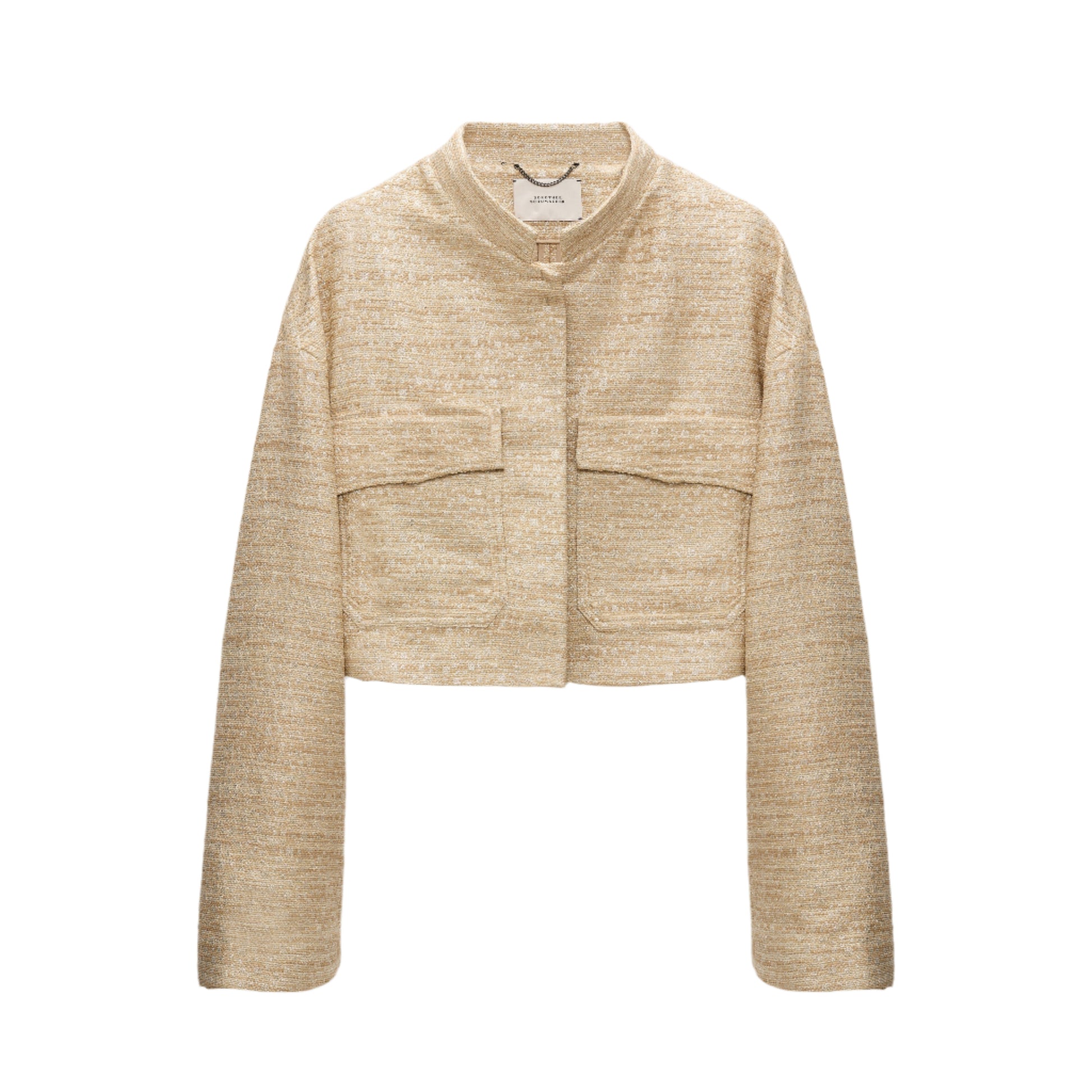 The Shiny Coolness Jacket by Dorothee Schumacher is a beige Lurex-tweed piece with a boxy silhouette, long sleeves, front flap pockets, and a round collar, shown against a white background.