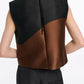 A person wears the Dorothee Schumacher Soft Petal Top—sleeveless, black and brown cloque jacquard with a back zipper—paired with black pants. The Italian fabric artistry is highlighted as they're shown from behind against a plain background.