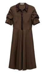 Dorothee Schumacher's Poplin Power Short Sleeve Dress in brown cotton-poplin features a flared skirt, ruched sleeves, and a contrasting dark collar and placket, shown on a white background.