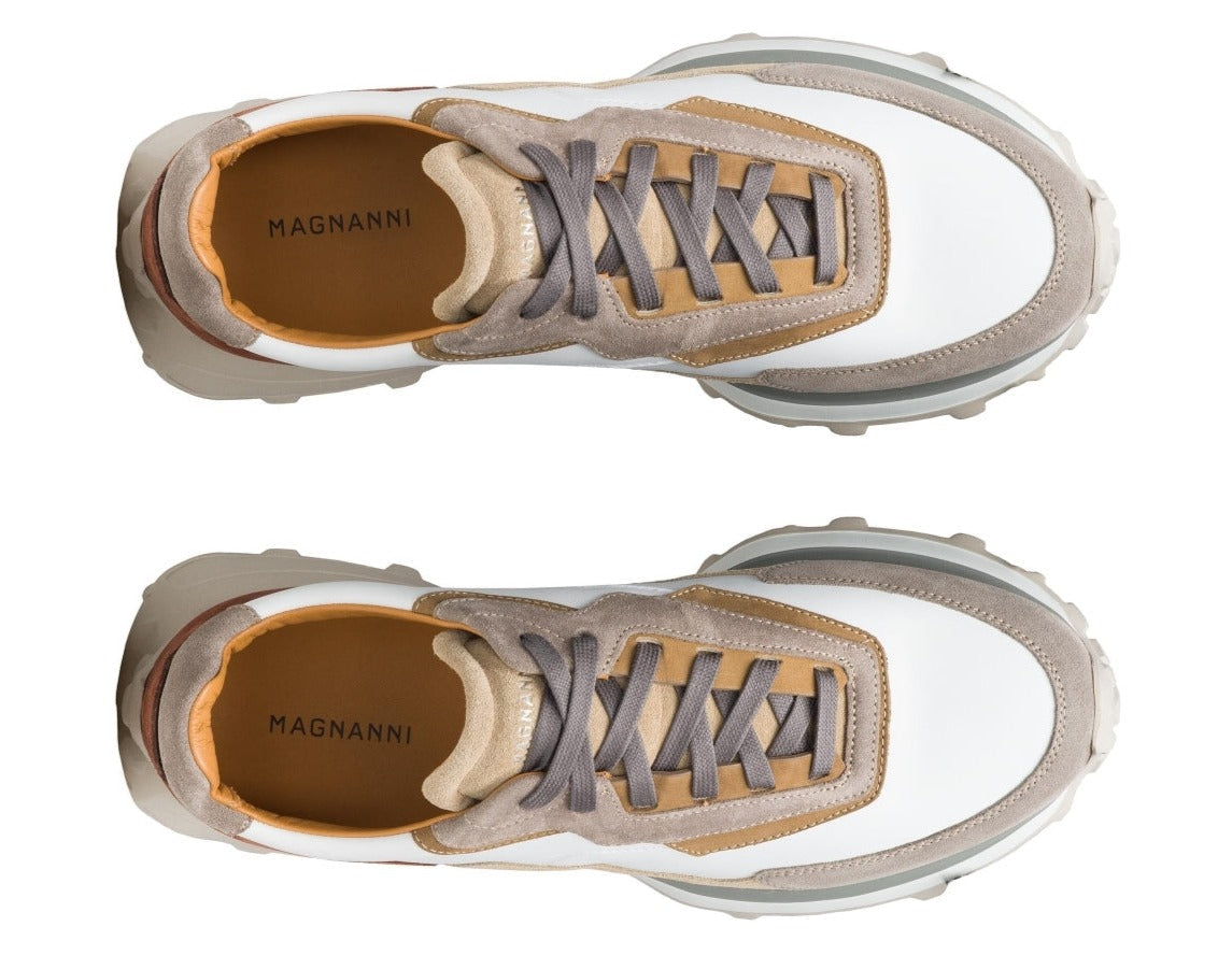 Top view of two identical sneakers featuring beige, white, and brown tones with "MAGNANNI" on the insole, highlighting the luxurious design and sleek aesthetics of the Magnanni Onyx Sneaker.