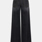 Back view of Dorothee Schumacher's Deep Love Pants—wide-leg, dark wash black denim jeans with two back pockets and a waistband featuring a black label.