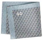 Light blue Geometric Silk Oxford Pocket Square from Eton, featuring a striking geometric motif and a small white brand tag. Expertly folded to showcase its elegant Oxford-woven silk finish with visible edges.