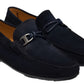 The Monterey Braid Bit Driver Loafer by Magnanni is a slip-on crafted from dark blue suede, featuring a metal buckle and braided detail on a supple calfskin upper, finished with a rubber sole for added comfort.