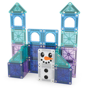 A building made of translucent MAGNA-TILES from the Magnatiles Winter Wonderland 26-Piece Travel Set features two towers and a snowman face at the center, inspiring imaginative magnetic play.