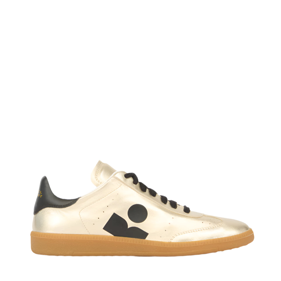 The Isabel Marant Kaycee Sneaker has light gold metallic leather, a black side logo, black laces, and a gum rubber sole.