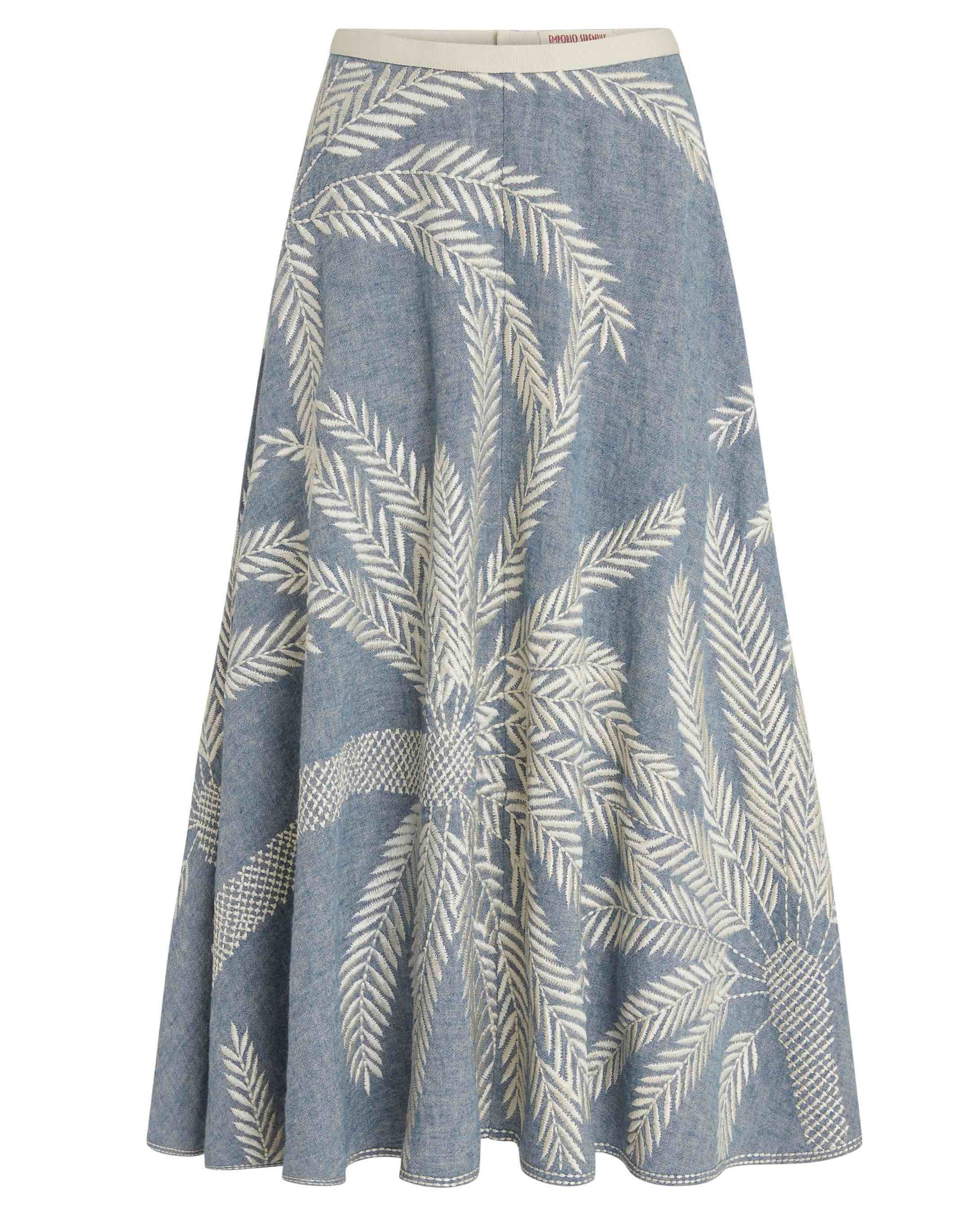 The Emporio Sirenuse Tasha Palm Embroidery Skirt is an A-line denim design with delicate palm stitch embroidery, exuding a subtle tropical charm.