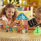 Two children enjoy imaginative play with the colorful Magnatiles Puppy Park 27-Piece Set and small animal figures on a wooden table in a brightly lit room.