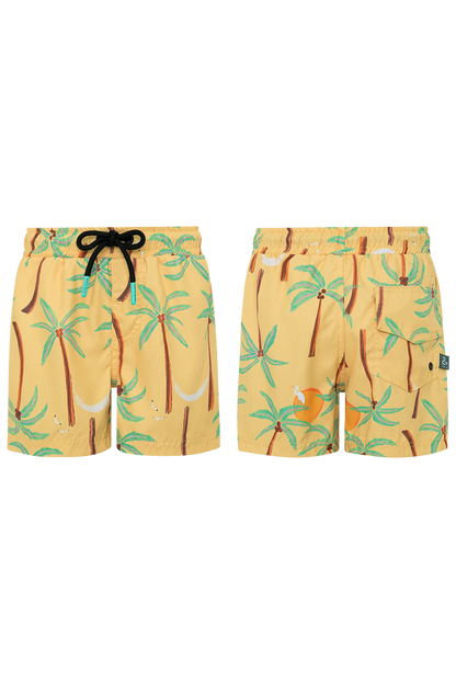 Pepita & Me Boys’ Swim Trunks in yellow with drawstring, made from quick-dry fabric and featuring a palm tree and hammock print, shown from front and back views.