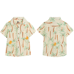 Front and back view of the Pepita & Me Baby Boys' and Boys' Guayabera Button Down, a short-sleeve summer shirt with tropical palm tree and orange fruit print on light cream, made from natural fiber.