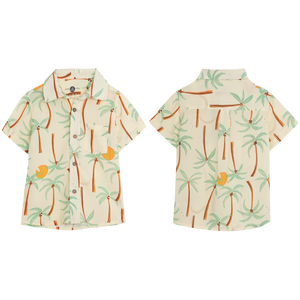 Front and back view of the Pepita & Me Baby Boys' and Boys' Guayabera Button Down, a short-sleeve summer shirt with tropical palm tree and orange fruit print on light cream, made from natural fiber.