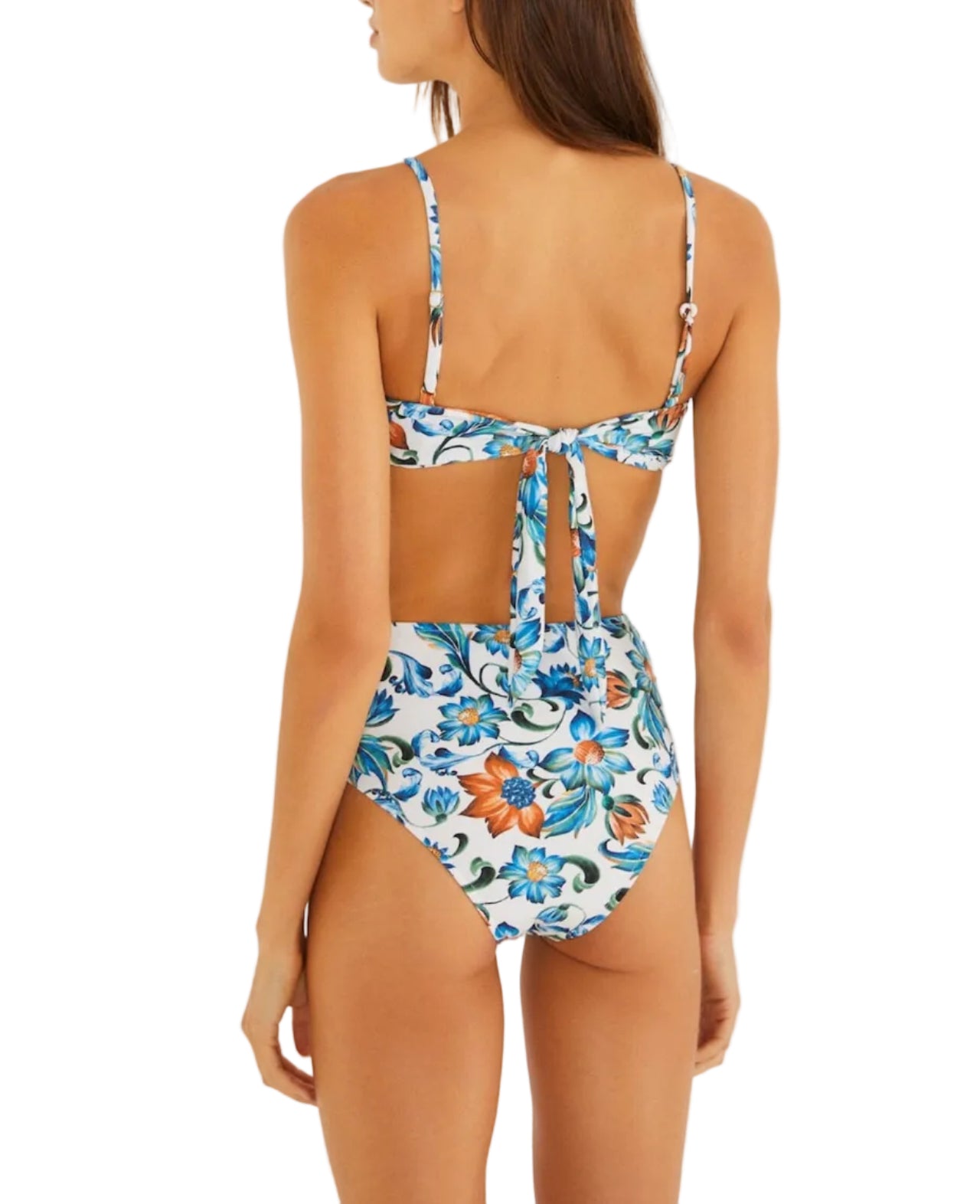 A woman is seen from behind wearing the Flora Tile Off White Bikini by Farm Rio, featuring a high-waisted fit, floral print, and back tie, set against a plain background.