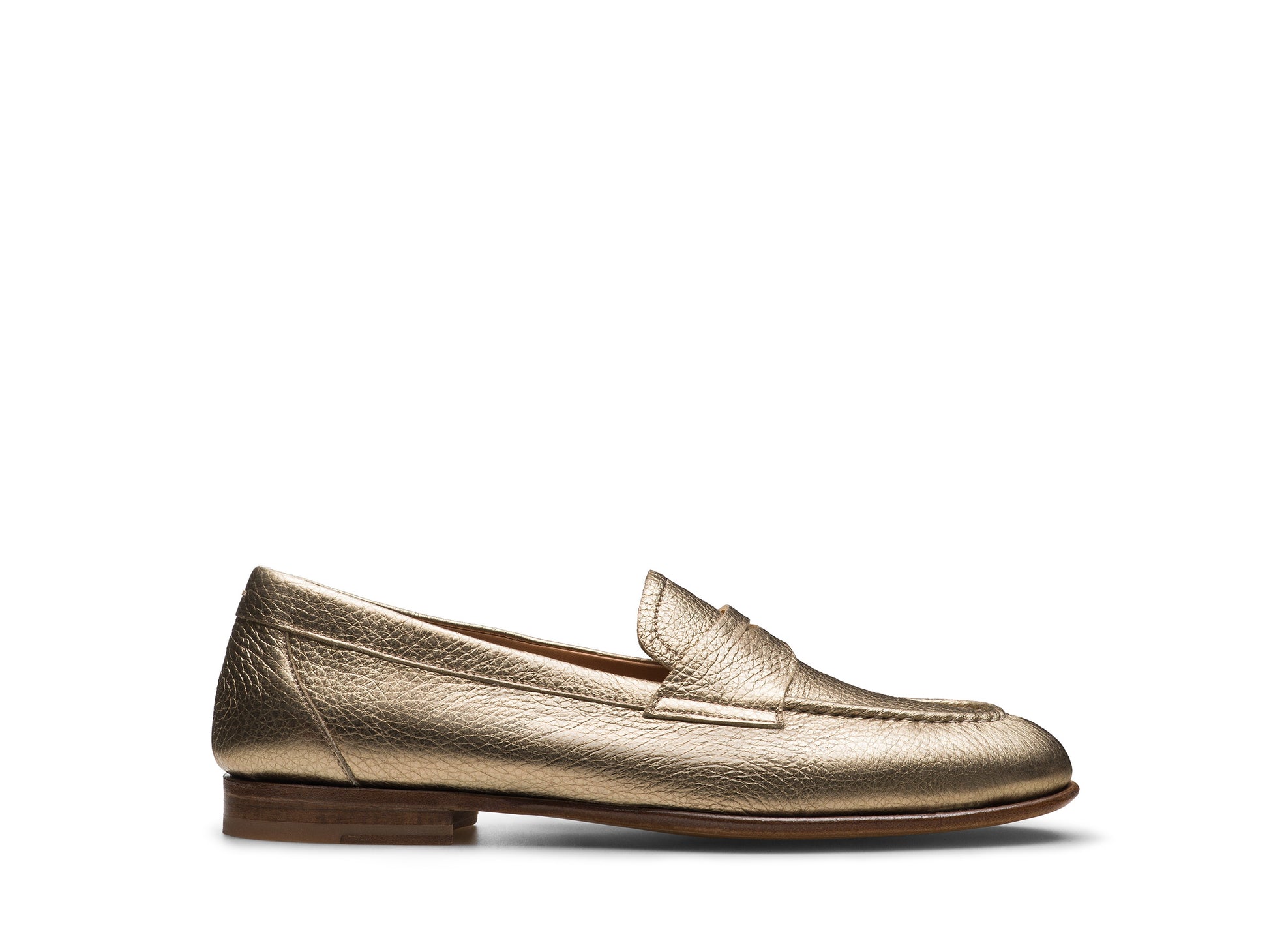 The Sonya Metallic Loafer by Magnanni features gold metallic leather, an apron toe, low wooden heel, and penny slot detail. Shown in profile on a white background.