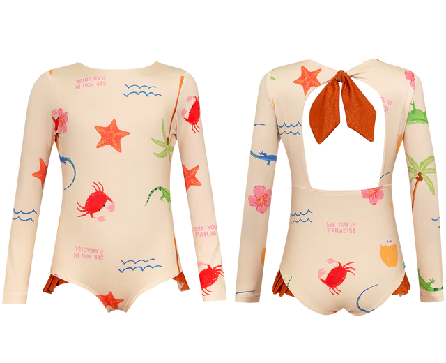 Two Pepita & Me Baby Girls' and Girls' Knot LS Rashguard swimsuits feature long sleeves, beige fabric with colorful sea-themed prints (crabs, starfish, plants), UPF50+ sun protection, and a back cutout with a large rust-colored bow.