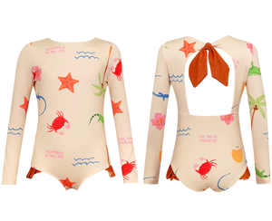 Two Pepita & Me Baby Girls' and Girls' Knot LS Rashguard swimsuits feature long sleeves, beige fabric with colorful sea-themed prints (crabs, starfish, plants), UPF50+ sun protection, and a back cutout with a large rust-colored bow.