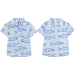 Pepita & Me Baby Boys' and Boys' Guayabera Button Down, shown front and back on white. Features a blue fish pattern and is crafted from natural fiber for comfort and breathability.