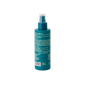 A teal Barberino's Texturizing Sea Salt Spray bottle with a clear cap, shown from the back, displays white instructions—ideal for easy beach waves.