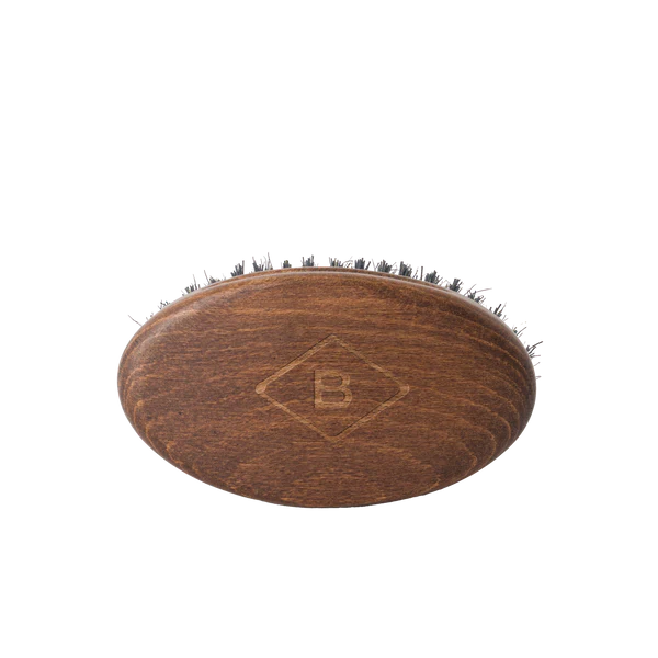 Barberino's Beard Brush: oval wooden brush with short, densely packed natural bristles and an engraved "B" logo on top. Ideal for beard grooming, shown on a plain white background.