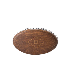 Barberino's Beard Brush: oval wooden brush with short, densely packed natural bristles and an engraved "B" logo on top. Ideal for beard grooming, shown on a plain white background.