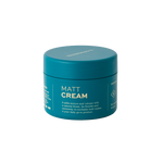 A teal container labeled "Matt Cream" by Barberino's for hair, featuring anti-frizz benefits, added texture and volume, and a reworkable medium hold.