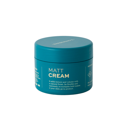 A teal container labeled "Matt Cream" by Barberino's for hair, featuring anti-frizz benefits, added texture and volume, and a reworkable medium hold.