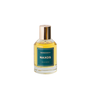 A clear glass bottle of Barberino's Naxos Perfume Cologne, featuring a gold cap, green label, and yellow liquid, captures Mediterranean elegance and the lush charm of Naxos gardens against a white background.