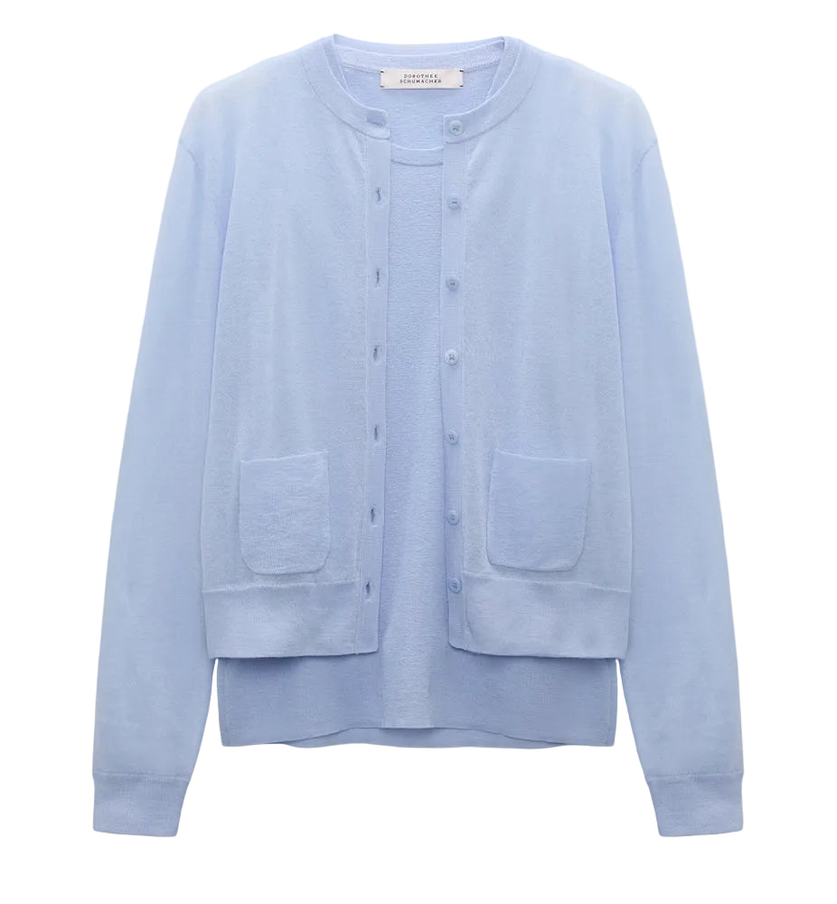 The Dorothee Schumacher Sheer Summer Twinset is a light blue, stretch cotton long-sleeve cardigan with front buttons and two patch pockets, shown on a plain white background.