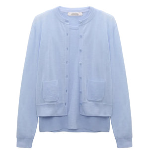 The Dorothee Schumacher Sheer Summer Twinset is a light blue, stretch cotton long-sleeve cardigan with front buttons and two patch pockets, shown on a plain white background.