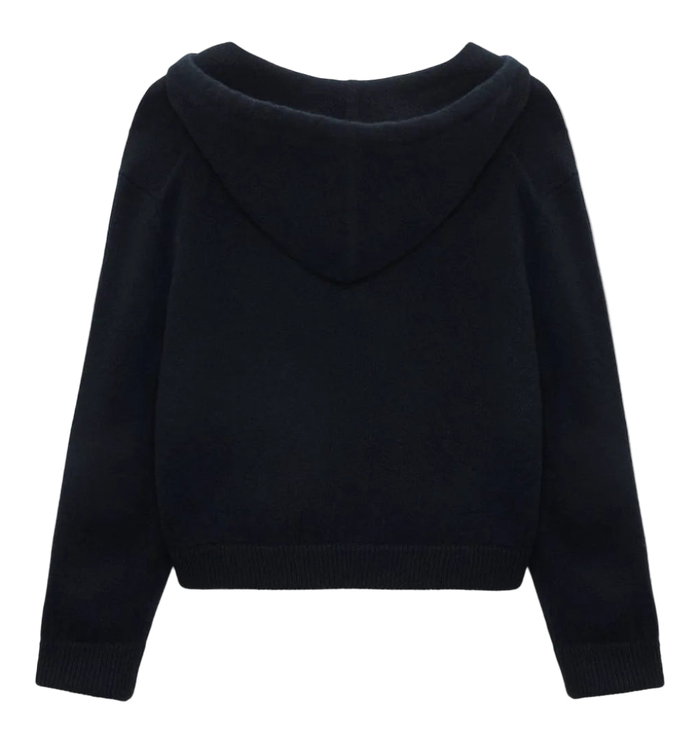 The Modern Statements Pullover by Dorothee Schumacher is a black cropped hoodie with long sleeves, a ribbed hem, and a boxy fit, shown from the back.