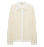 The Airy Softness Cardigan by Dorothee Schumacher is a cream alpaca-wool piece featuring long sleeves, a waffle-knit texture, button front, and a large pointed collar.