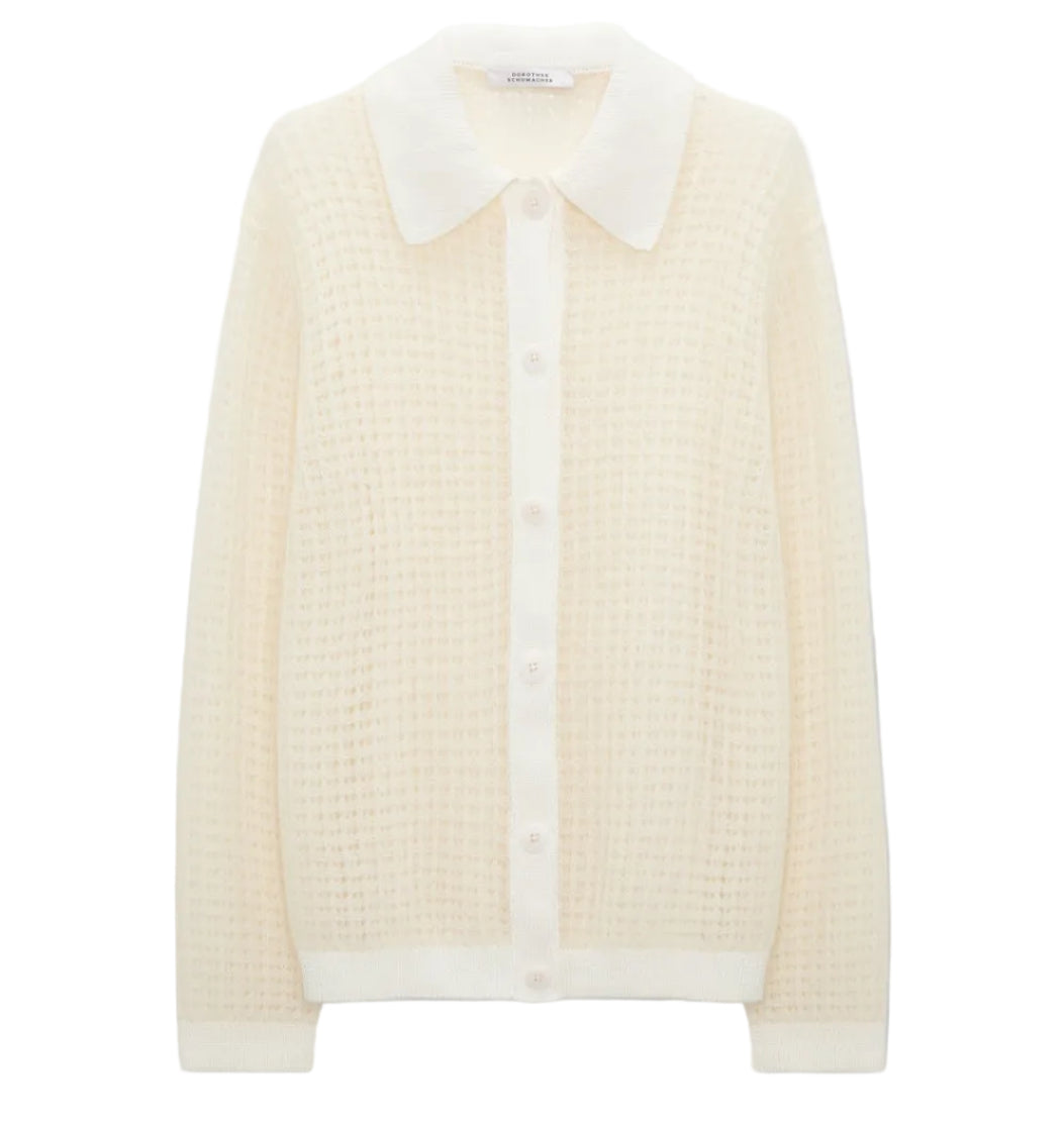 The Airy Softness Cardigan by Dorothee Schumacher is a cream alpaca-wool piece featuring long sleeves, a waffle-knit texture, button front, and a large pointed collar.