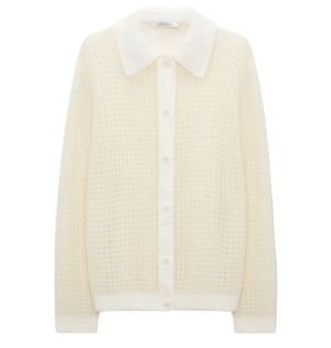 The Airy Softness Cardigan by Dorothee Schumacher is a cream alpaca-wool piece featuring long sleeves, a waffle-knit texture, button front, and a large pointed collar.