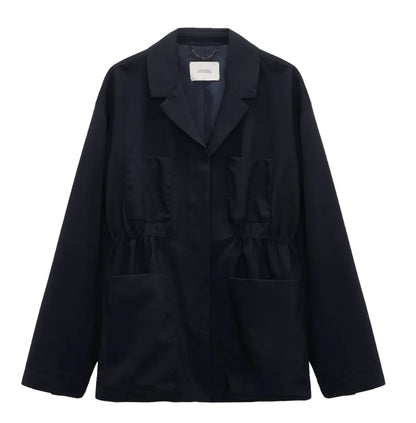 The Dorothee Schumacher Casual Attraction Jacket is a dark navy, long-sleeved virgin wool field jacket with a collar, two chest pockets, and two lower front pockets, shown against a white background.