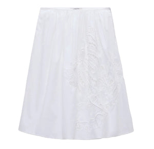 The Embroidered Beauty Skirt by Dorothee Schumacher is a white cotton A-line skirt with one-side delicate floral embroidery, a fitted waistband, crochet trim, and knee-length hem.