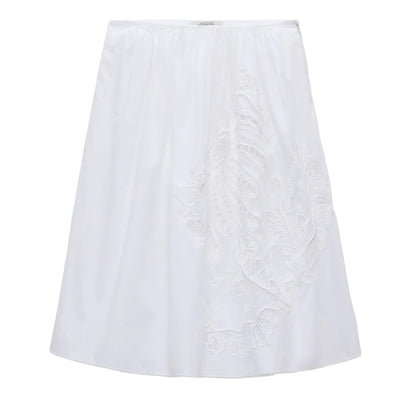 The Embroidered Beauty Skirt by Dorothee Schumacher is a white cotton A-line skirt with one-side delicate floral embroidery, a fitted waistband, crochet trim, and knee-length hem.