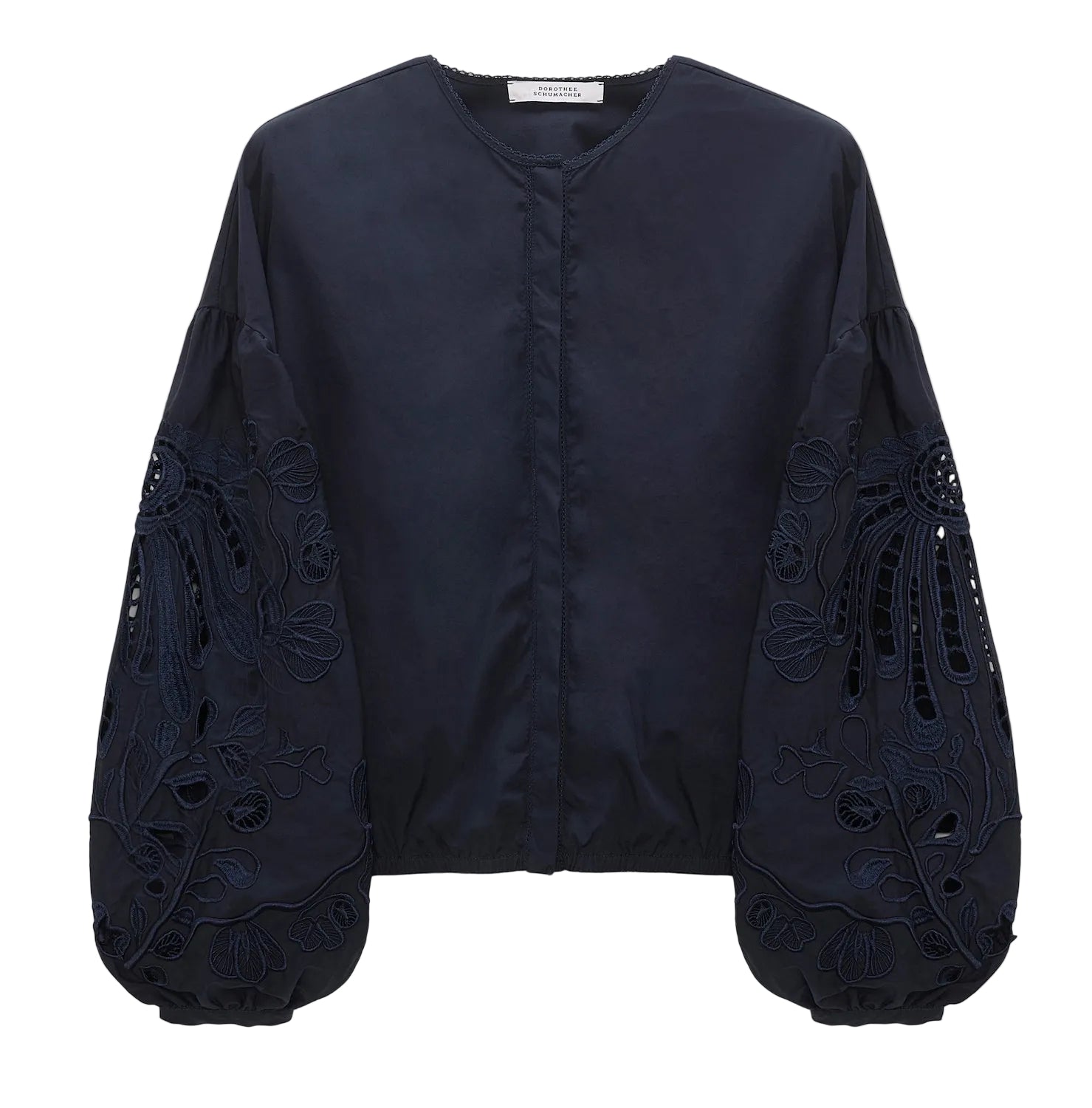 The Embroidered Beauty Blouse by Dorothee Schumacher features a navy blue cotton design with a round neck, voluminous long sleeves, intricate floral embroidery, and elegant cut-out details.