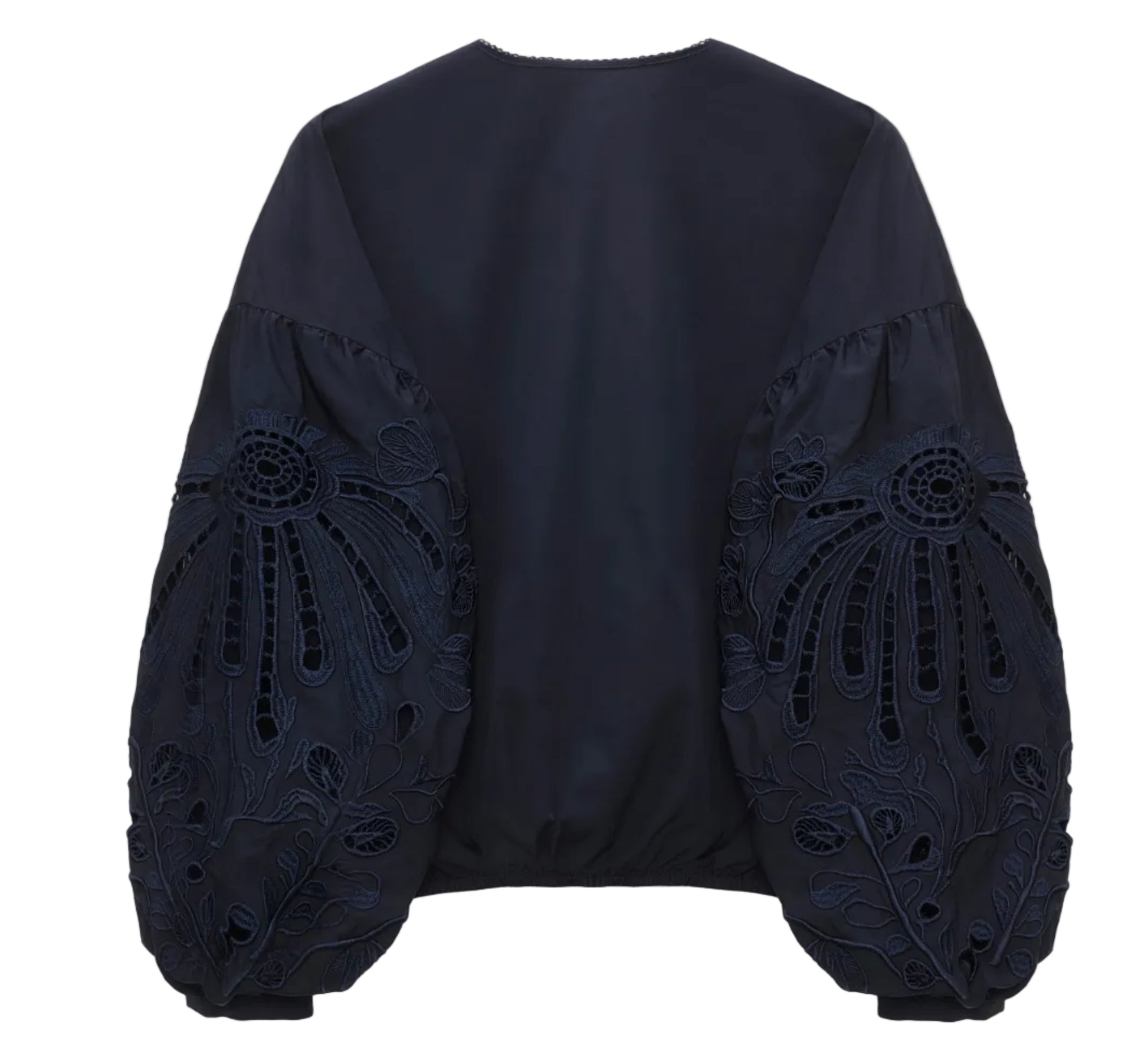 The Embroidered Beauty Blouse by Dorothee Schumacher features navy blue cotton and voluminous floral embroidery on the long sleeves, with a plain back.