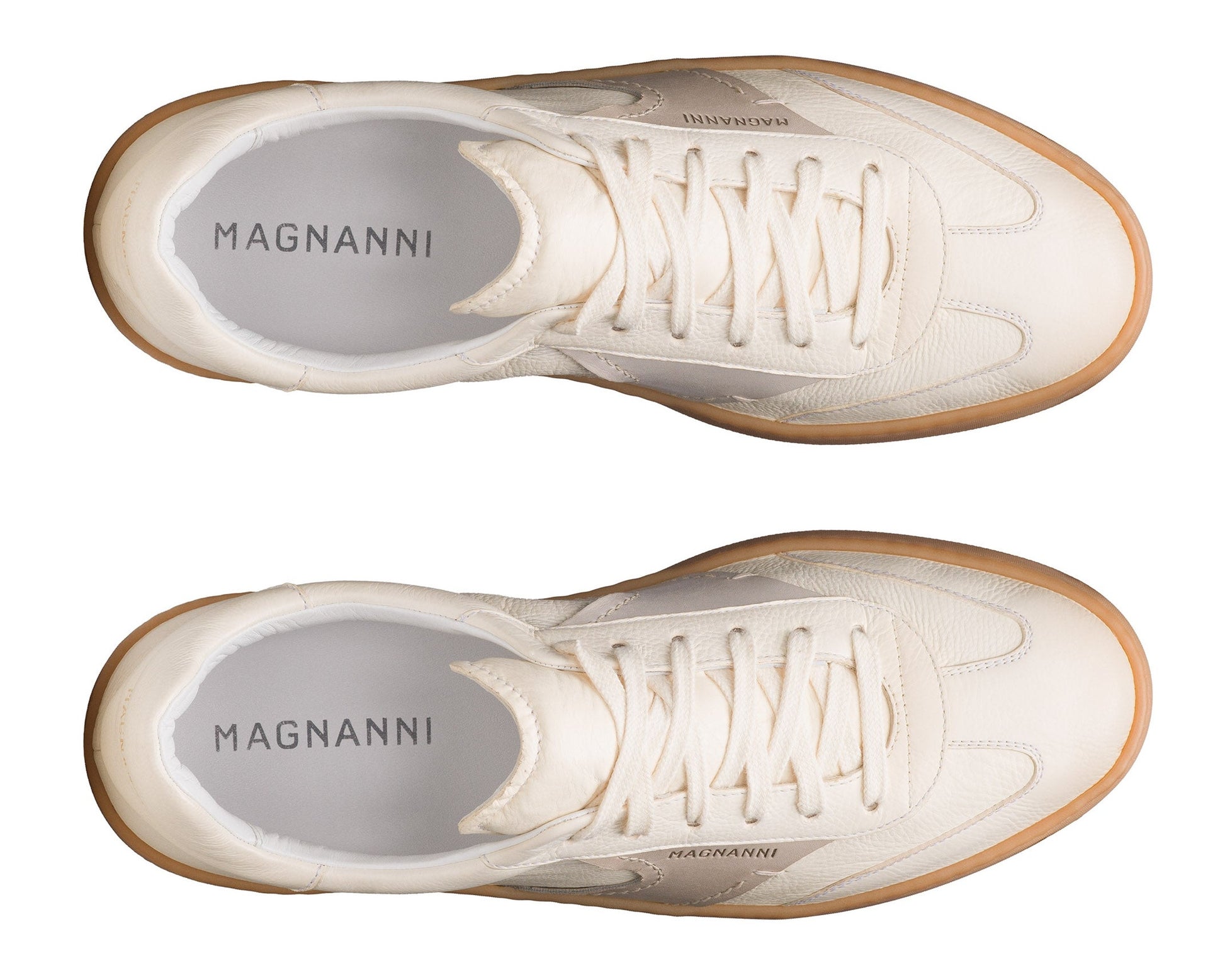 Top-down view of a pair of Magnanni Zori Sneakers with white leather uppers and gum soles, displayed side by side on a white background.