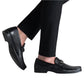 Someone styled in the Gentry Soft Bit Loafer from Magnanni, featuring a black leather design and metal buckle, paired seamlessly with black pants.